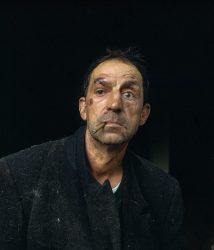 Tony used to arrive home with nuts, claiming that his girlfriend, Rosemary, had given them to him. However, Rosemary only existed in his mind. Tony resides in Atas, a small remote village on the border between Galicia and Portugal. He grew up with alcoholic parents and, unfortunately, became an alcoholic himself. Tony says, "I remember that when I was a child my father would put a glass of wine on the table for me and tell me 'Drink! A little bit won't hurt you". When Tony drinks alcohol he quickly loses control over himself to the point of losing an eye due to a car accident while driving drunk. He currently lost his job due to his alcoholism and lives on state aid and his family's charity. The depression in the area, the lack of job opportunities, and the communication difficulties made it even more challenging for him to overcome his alcoholism.Aprile, 7tt. 2023. Atás, Galicia.