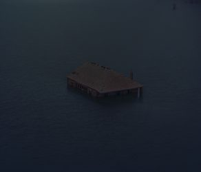 In the 1970s, in the village of O Bao, located on the border between Galicia and Portugal, a house was built for the forest ranger to live in. His task was to safeguard the area’s forests, particularly to prevent wildfires. After the construction of the Limia River dam in the 1990s, the village of O Bao was completely submerged, including the forest ranger’s house, which resurfaced 30 years later due to the drought that had nearly emptied the reservoir. The house, seemingly floating on the water, appears like a ghost of the life that once thrived there. According to Francisco Gallato, a former resident of O Bao: “Perhaps the passage of time will one day heal all the pain caused by the abandonments brought about by the emigrations of the past.”January, 9th. 2022. Aceredo, Galicia.